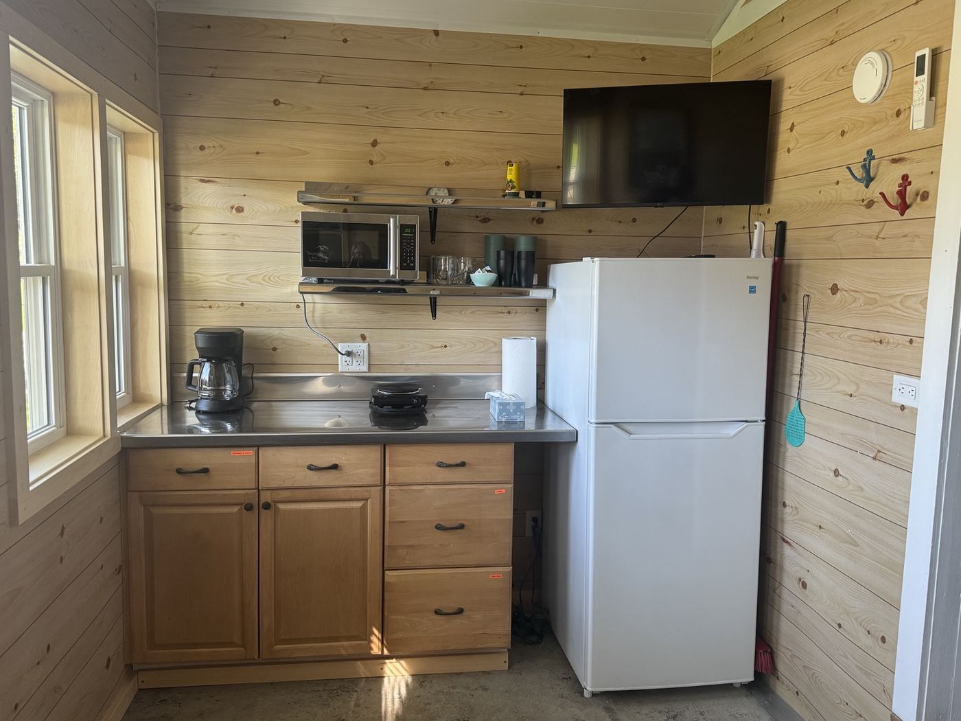 Kitchenette and television inside the separate bunkie